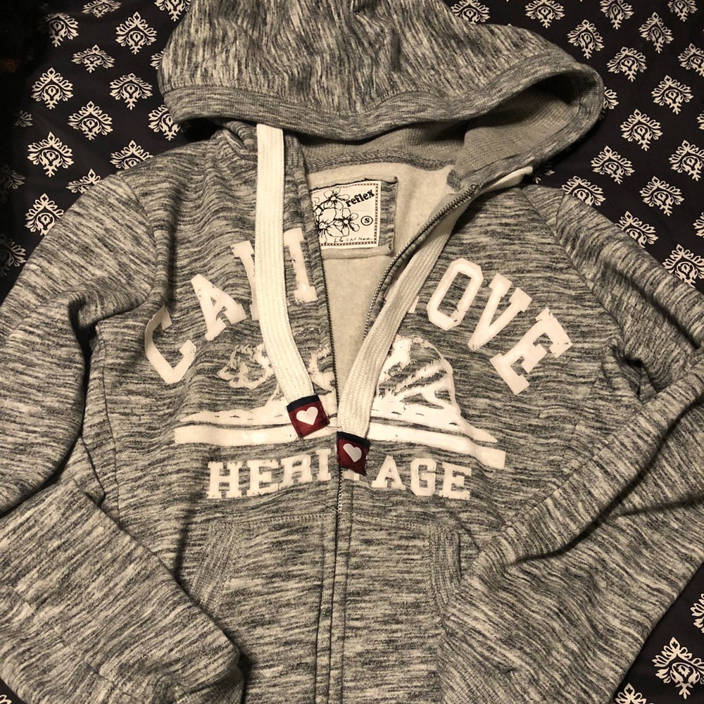 Cali Love zip up sweater.